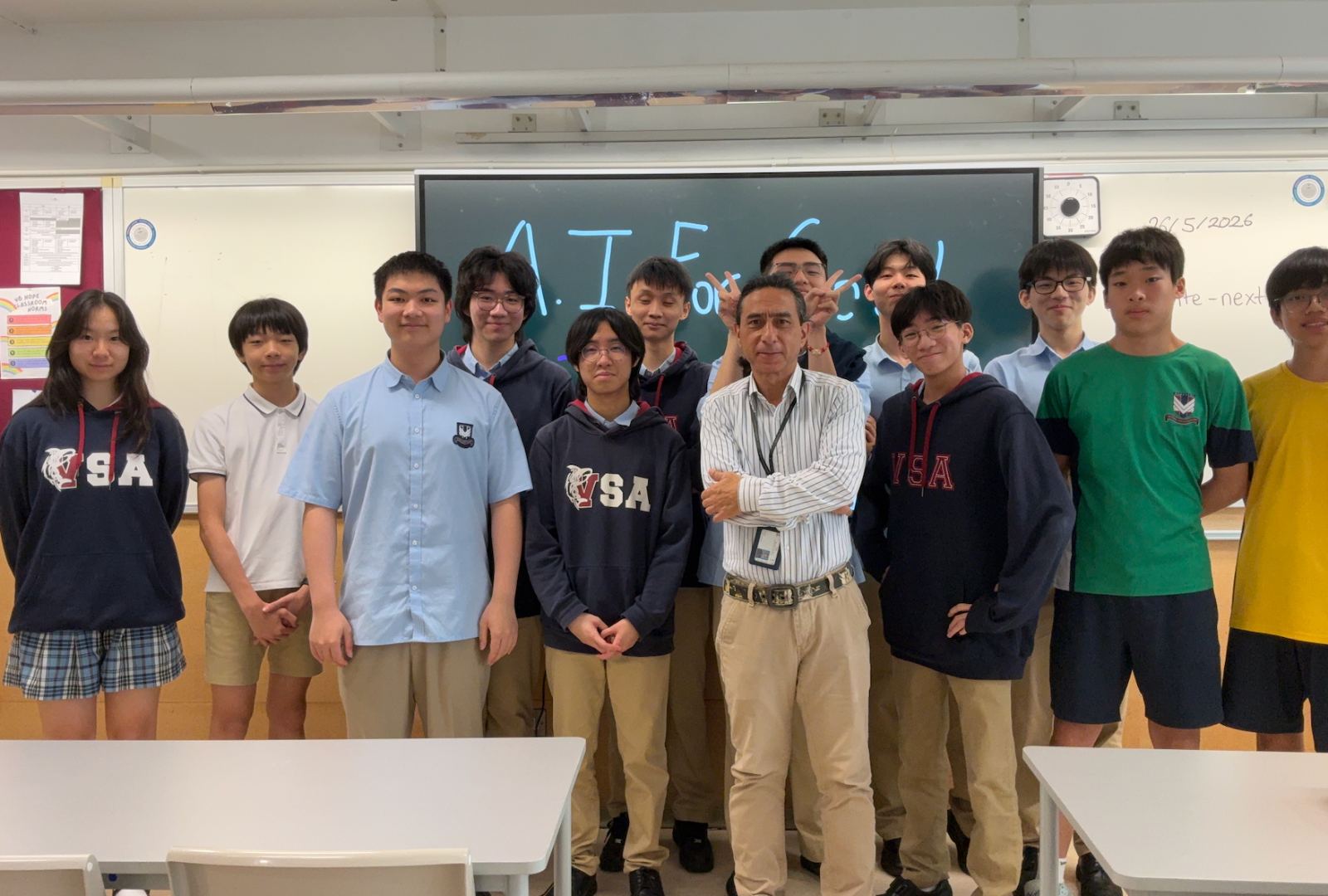 The 2025/26 group of students and tutors together in the classroom.